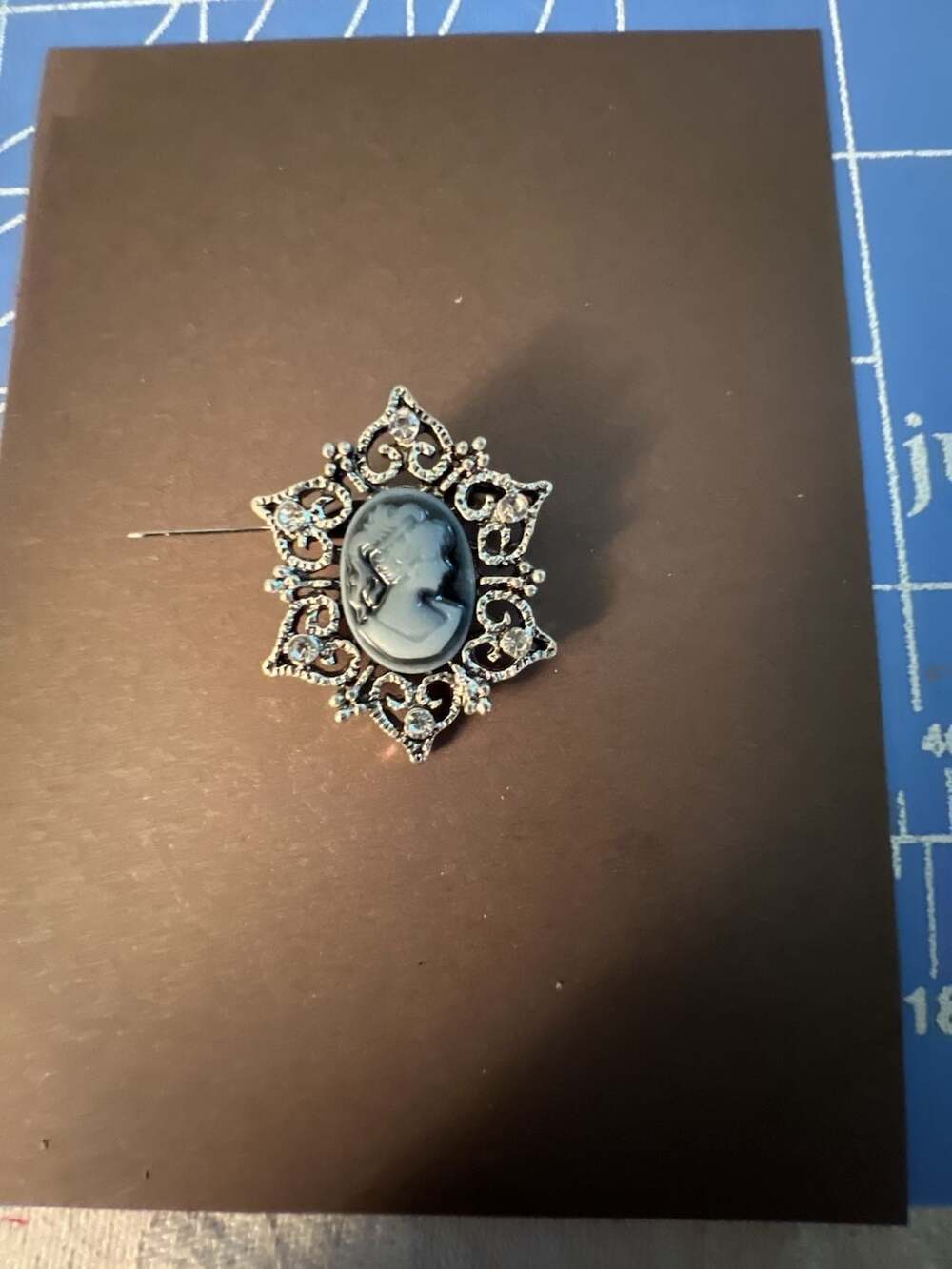 Vintage Silver Tone Filigree Cameo Brooch with Rhinestone Accents